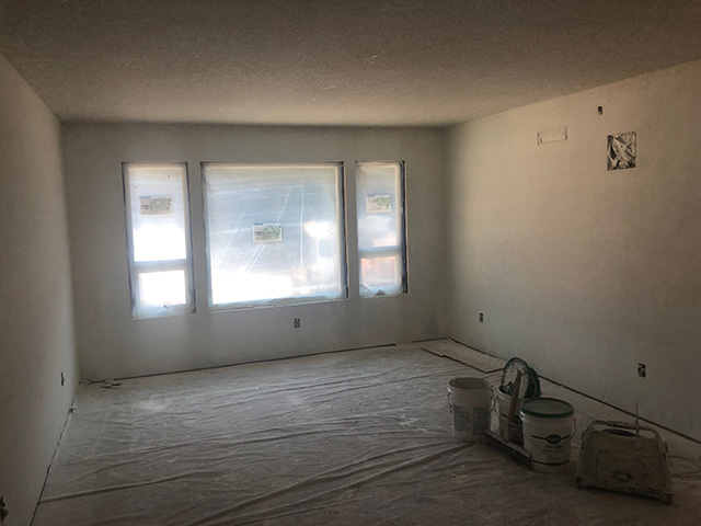 inside a new room with drywall